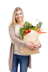 Image showing Beautiful woman carrying vegetables