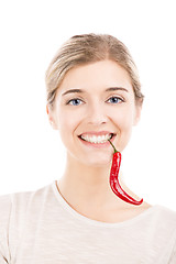 Image showing Beautiful woman holding a red chilli pepper