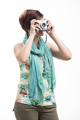 Image showing Woman taking a photo with a vintage camera