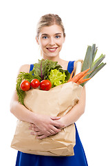 Image showing Beautiful woman carrying vegetables