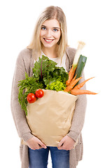 Image showing Beautiful woman carrying vegetables