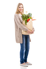 Image showing Beautiful woman carrying vegetables