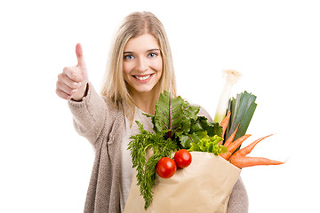 Image showing Beautiful woman carrying vegetables