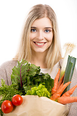 Image showing Beautiful woman carrying vegetables