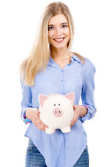 Image showing Beautiful woman holding  a piggy bank