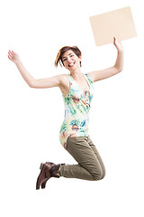 Image showing Beautiful woman jumping and holding a cardboard