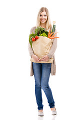 Image showing Beautiful woman carrying vegetables