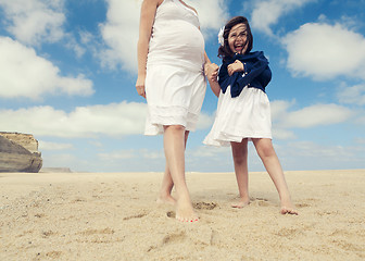 Image showing Woman and her daughter on the beach