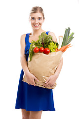 Image showing Beautiful woman carrying vegetables