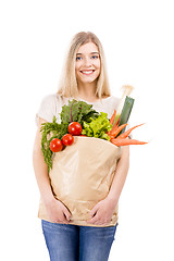 Image showing Beautiful woman carrying vegetables