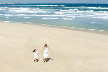 Image showing Walking on the beach