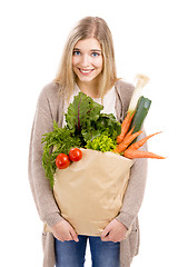 Image showing Beautiful woman carrying vegetables