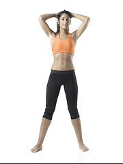 Image showing fit woman stretching on white