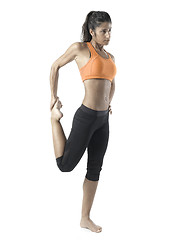 Image showing fit woman stretching on white