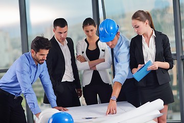 Image showing business people and engineers on meeting