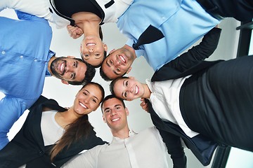 Image showing business people with their heads together