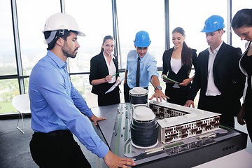 Image showing business people and engineers on meeting