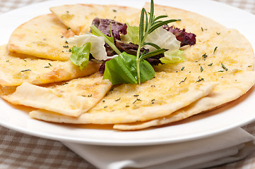 Image showing garlic pita bread pizza with salad on top