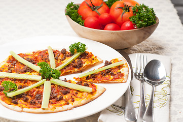 Image showing Turkish beef pizza with cucumber on top