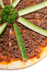 Image showing Turkish beef pizza with cucumber on top