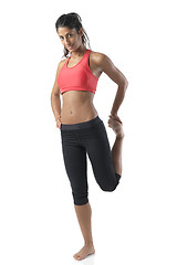 Image showing fit woman stretching on white