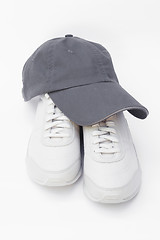 Image showing Running shoes and baseball cap