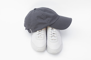 Image showing Running shoes and baseball cap