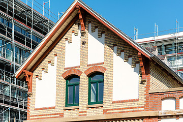 Image showing old building in front of modern