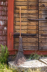 Image showing Broom at the entrance of a rustic house