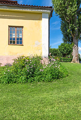 Image showing Classic Scandinavian house on a green lawn