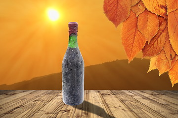 Image showing old wine bottle on table