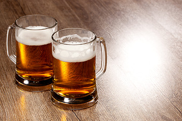 Image showing Two glass beer on wooden table