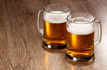 Image showing Two glass beer on wooden table