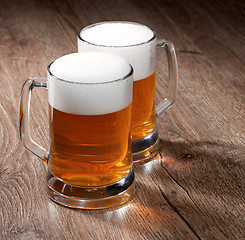 Image showing Two glass beer on wooden table