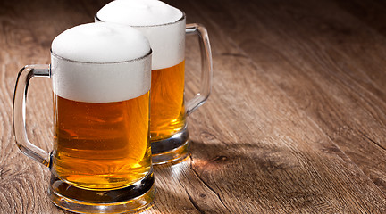 Image showing Two glass beer on wooden table