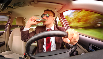 Image showing Drunk man driving a car vehicle.