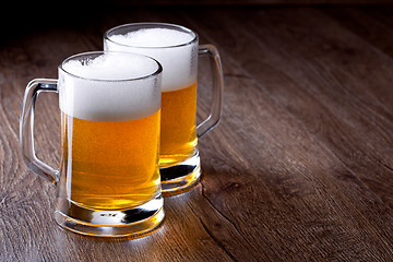 Image showing Two glass beer on wooden table