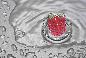 Image showing strawberry falling into water