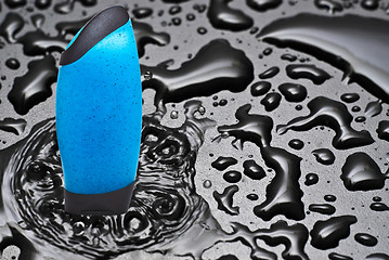 Image showing Blue shower gel in water 