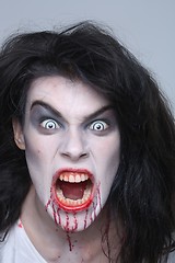 Image showing Psychotic Bleeding Woman in a Horror Themed Image