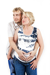 Image showing loving happy couple, pregnant woman with her husband, isolated on white