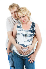 Image showing loving happy couple, pregnant woman with her husband, isolated on white