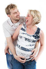 Image showing loving happy couple, smiling pregnant woman with her husband