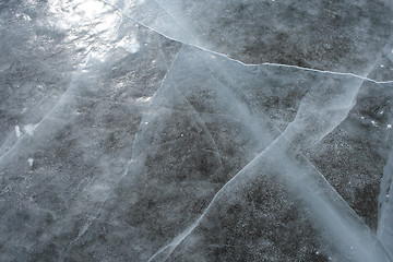 Image showing Sun reflecting in the cracked ice surface