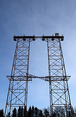 Image showing Big double electricity pylon in the forest