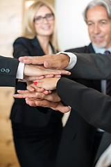 Image showing Teamwork - business people with joint hands in the office