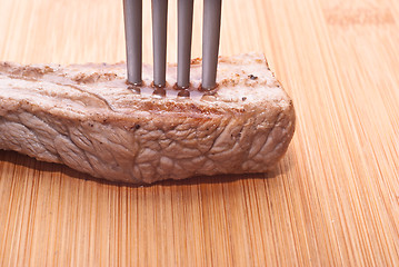 Image showing beef with fork