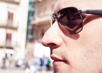 Image showing portrait of a attractive gorgeous guy wearing sunglasses