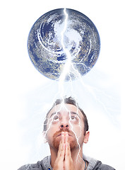 Image showing man praying and looking up the earth