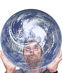 Image showing man holds the earth and look up